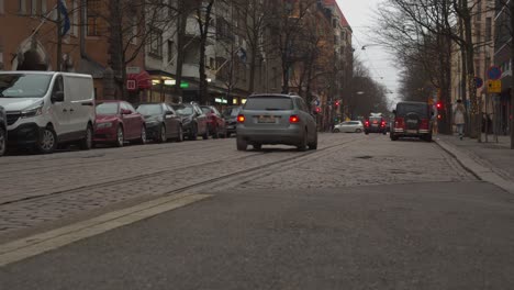 Low-angle-view-of-tram-lines-on-cobbled-street-in-Helsinki-Finland