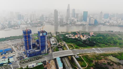Construction-site-in-smoggy-Ho-Chi-Minh-City-on-banks-of-Saigon-river