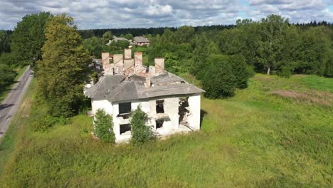 Drone-video-of-the-roofless-abandoned-house-with-old-chimneys