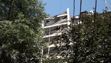 The-rear-of-a-hotel-lies-damaged-with-its-centre-destroyed,-floors-collapsed-and-rooms-exposed-over-the-entrance-following-a-Russian-missile-strike-during-the-Russian-war-in-Ukraine
