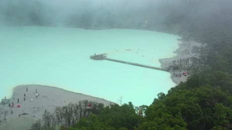 wide-aerial-of-tourists-at-Kawah-Putih-on-cloudy-day-in-Bandung-Indonesia