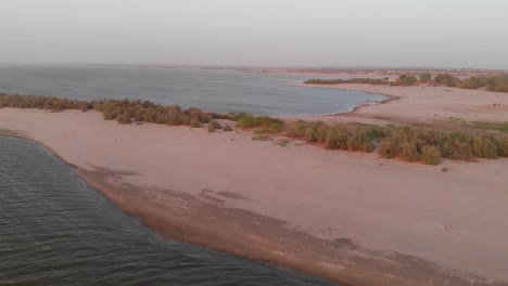 Drone-Dolly-Over-Sand-Beach-Coastline-In-Balochistan-Beside-The-Arabian-Sea