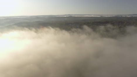 Rotating-Drone-shot-of-fog-over-Oak-Hills,-West-Virginia