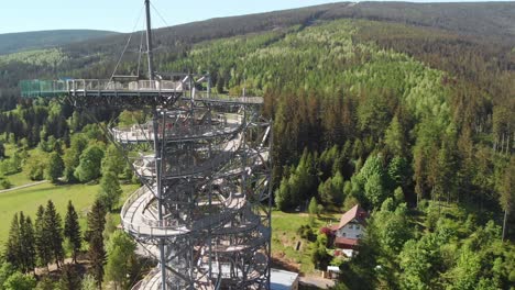 Aerial-orbit-over-the-observation-tower-located-in-the-middle-of-the-forest-in-Sudety-mountains