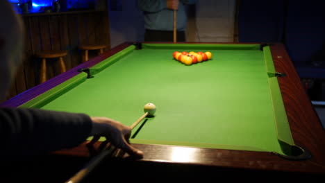 A-man-breaking-the-balls-in-a-game-of-pool