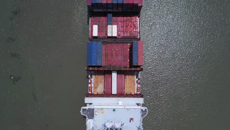 Top-down-aerial-view-of-the-stern-and-bridge-of-a-large-container-ship-on-a-sunny-day
