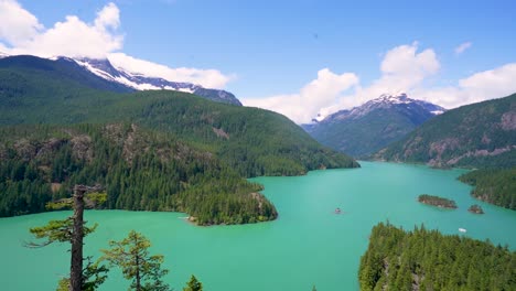 Diablo-Lake---Beautiful-turquoise-waters-surrounded-by-snow-caped-mountains-in-the-North-Cascades-National-Park-in-Washington-State,-United-States