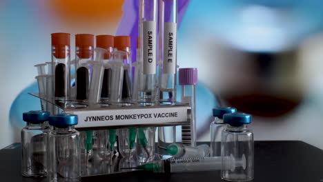 Glass-test-tubes-with-samples-of-Jynneous-Monkeypox-vaccine-are-being-taken-off-the-metal-rack