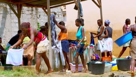 Women-gather-at-the-public-well-to-had-wash-their-laundry