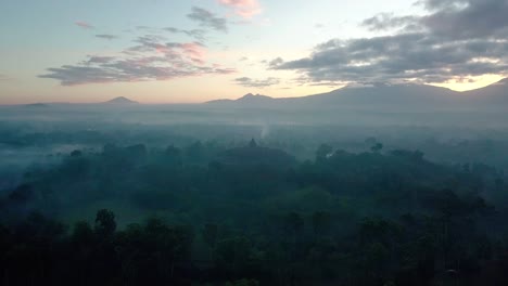 Cinematic-shot-of-famous-BOROBUDUR-TEMPLE-during-Sunrise-in-the-morning-in-slightly-foggy-weather---Magelang,Indonesia