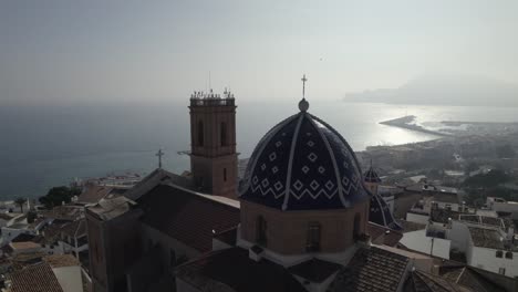 Drone-flight-over-dome-of-Catholic-Church-of-The-Virgin-of-Consol-in-Altea,-Spain