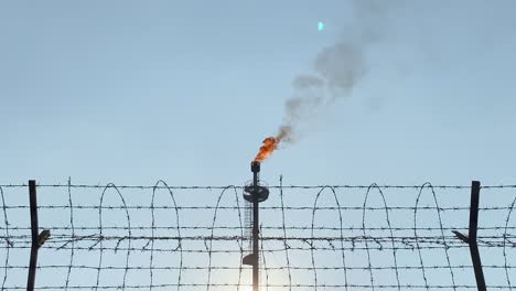 Footage-of-gas-plant-burning-gases,-amidst-gas-price-war-due-to-Ukraine-war-and-Russia's-economic-situation-with-EU