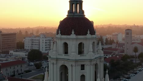 Cinematic-aerial-view-of-Pasadena-City-Hall-during-sunset,-establishing-shot-with-bright-glowing-color