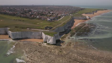 Kingsgate-bay-chalk-cliff-coastal-formation-English-Kent-seaside-Aerial-view-high-right-orbit-from-distance