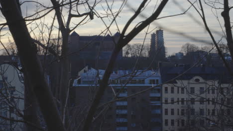 Winter-cityscape-skyline-over-Stockholm,-sunset,-Vasastan,-Norra-Tornen