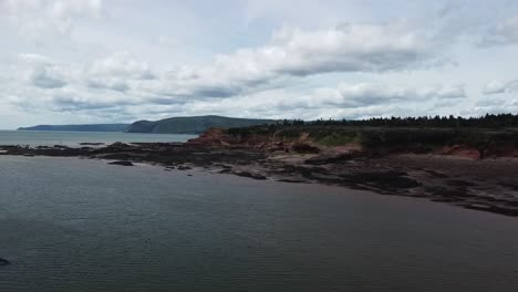 Drone-shot-over-Bay-of-Fundy-coastline-near-Waterside-Beach,-New-Brunswick