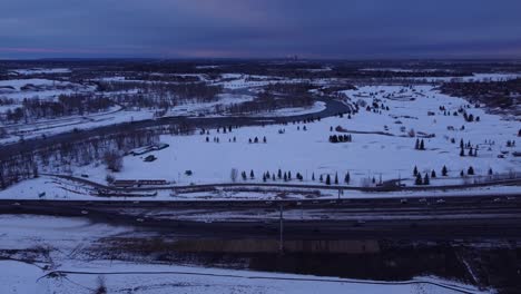 Winter-traffic-jams-from-above:-aerial-drone-footage-of-snowy-roads-in-canada
