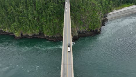 Overhead-aerial-view-of-a-truck-hauling-a-boat-across-Deception-Pass-on-Whidbey-Island