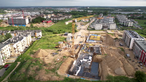 Construction-site-of-apartment-building-in-Gdansk,-Poland,-drone-view-from-above