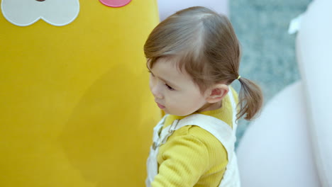Three-year-old-Female-Kid-At-The-Play-Area-Of-A-Shopping-Mall
