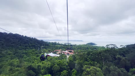 A-shot-of-people-going-up-and-down-in-cable-cars-over-the-hills-of-Langkawi