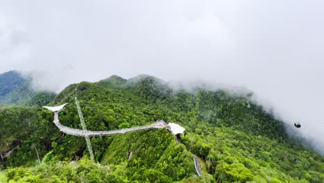 Areal-shot-that-captures-both-rope-way-and-walk-way-over-the-mountains-of-Langkawi