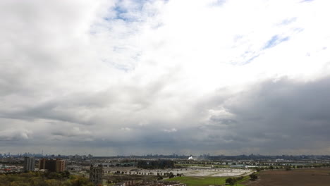 Time-Lapse-Of-Flowing-White-Clouds-Over-Toronto-City-Landscape