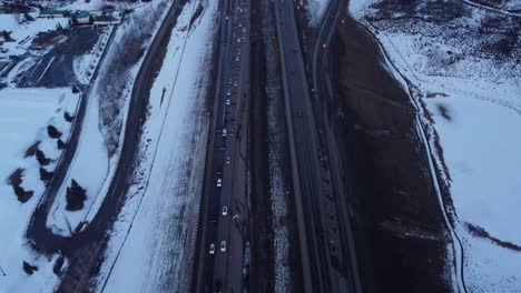 Sunset-aerial-drone-shot-of-winter-traffic-jam