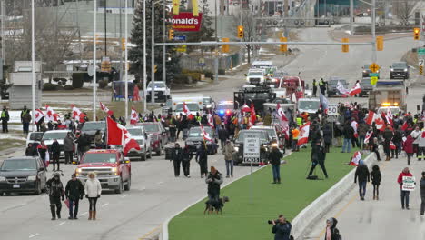 Protesters-on-the-street-in-Canada,-showing-the-national-flag