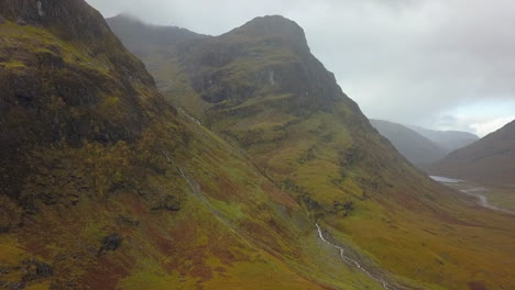 Bird's-eye-view-of-craggy-hanging-valley-in-cloudy-Scottish-highlands