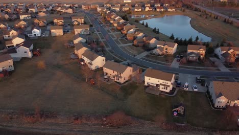 Rural-housing-development,-aerial-view-on-golden-hour-Flat-Rock,-Michigan,-USA