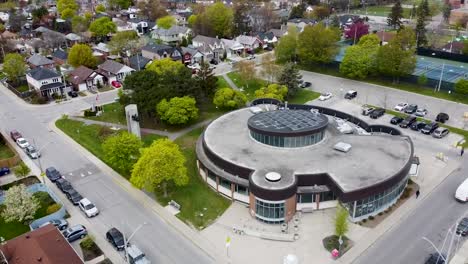 Drone-shot-of-a-community-centre-in-a-foggy-Toronto-neighborhood-in-the-spring
