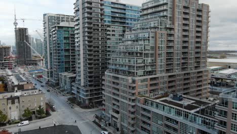 Drone-flying-along-apartment-buildings-on-an-overcast-day-in-downtown-Toronto