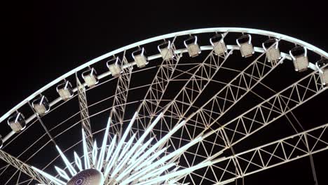 Ferries-Wheel-at-night,-bright-lights-Ferries-wheel,-spinning-Niagara-Falls,-Canda