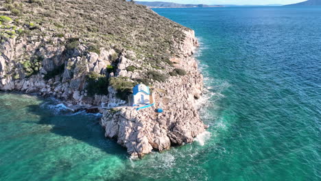 Flying-around-a-small-Greek-Orthodox-church-on-the-rock-next-to-the-sea