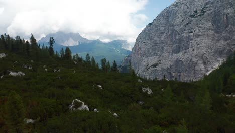 Aerial-Flying-Over-Forest-Woodland-Near-Lake-Sorapis-In-The-Dolomites