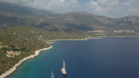 Hazy-Turkish-Mediterranean-sea-coast-with-tall-tour-ships-anchored