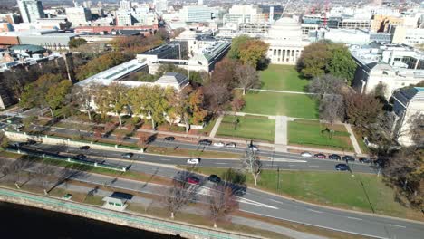 Aerial-View-of-Killian-Court-Park-and-Great-Dome,-Part-of-MIT,-Boston-MA-USA,-Memorial-Drive-Traffic-on-Sunny-Autumn-Day