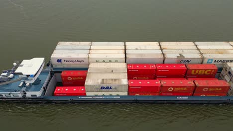 29-January-2023---Aerial-Overhead-View-Of-Denford-Cargo-Ship-Partnered-With-Barge-Transporting-Containers-Along-Oude-Maas