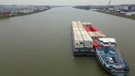 29-January-2023---Aerial-Strern-View-Of-Denford-Cargo-Ship-Partnered-With-Barge-Transporting-Containers-Along-Oude-Maas