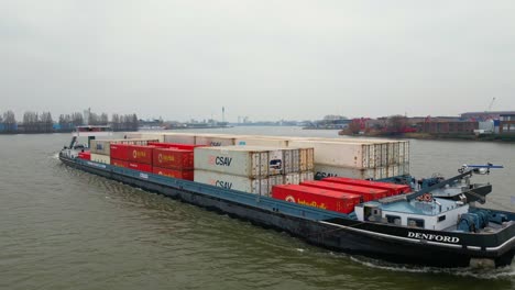 29-January-2023---Aerial-View-Of-Denford-Cargo-Ship-Partnered-With-Barge-Transporting-Containers-Navigating-Oude-Maas