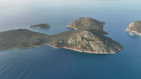 Flying-around-a-small-island-in-the-Aegean-sea,-Greece