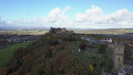 Aerial-flyover-of-old-grey-cemetery-beside-Sterling-Castle-in-Scotland