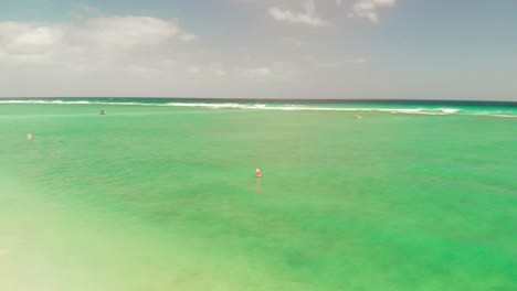 Flic-en-Flanc-beach-in-Mauritius-with-calm-green-water-and-orange-cones-installed-at-the-shore