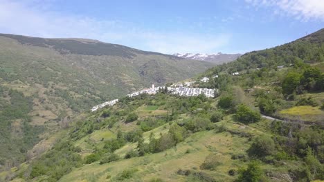 Drone-view-of-Capileira,-a-little-village-in-the-famous-Alpujarras,-Granada,-Spain