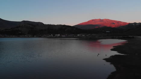AERIAL---Sunset-at-Lake-Agrio,-Caviahue,-Argentina-Patagonia,-slow-motion-forward