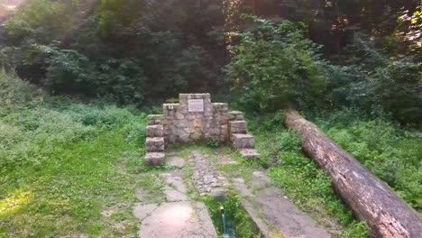 Old-stone-monument-at-edge-of-forest-near-Varbo,-Hungary-near-drainage