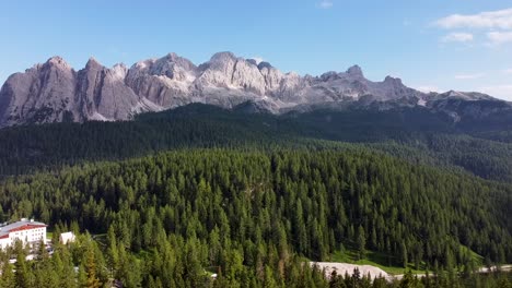 Iconic-view-of-Italy-Dolomites-with-forest-landscape-bellow,-aerial-view