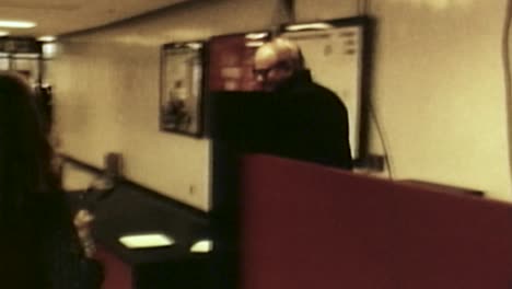 1971-MALE-CUSTOMER-GOING-THROUGH-OLD-AIRPORT-SECURITY-GATE