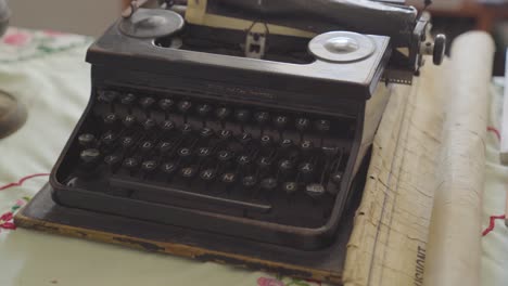 Vintage-antique-typewriter-on-table-of-old,-historic-house